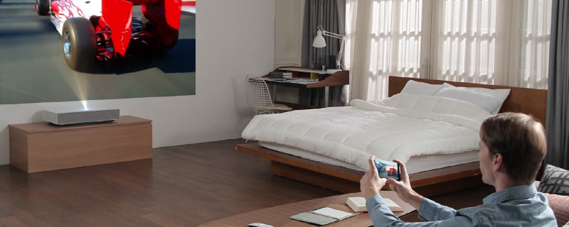 LG’s HU85L 4K projector needs 2-inches of space to project a 90-inch screen